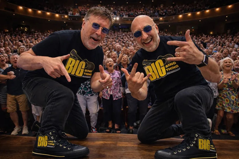 BIG SING THING duo on stage in custom branded high-top sneakers