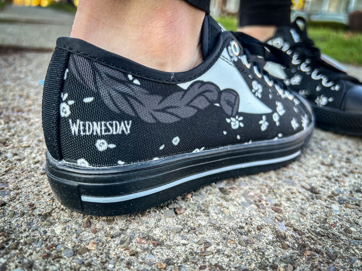 Customer with custom Wednesday-themed shoes